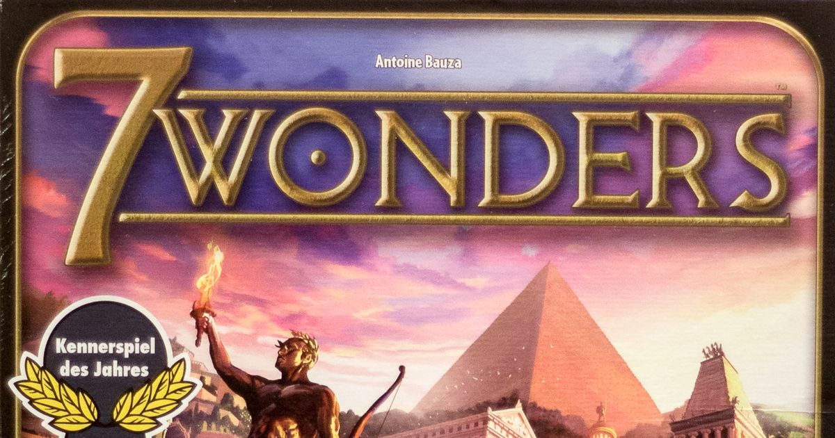 7 Wonders box art, an ancient wonder under construction against a sunset sky